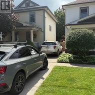 Driveway easily fits 2 larger or 3 smaller cars! - 