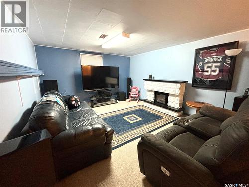 202 Herbert Street, Maple Creek, SK - Indoor Photo Showing Living Room With Fireplace