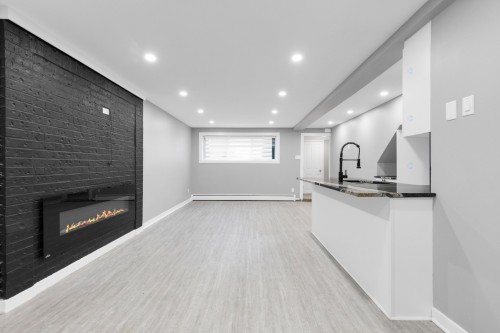 Kitchen - 11641  - 11645 Av. Laurier, Montréal (Montréal-Nord), QC - Indoor Photo Showing Other Room With Fireplace