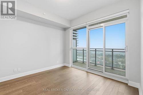 Bedroom with Balcony Access - 1801 - 33 Shore Breeze Drive, Toronto, ON - Indoor Photo Showing Other Room