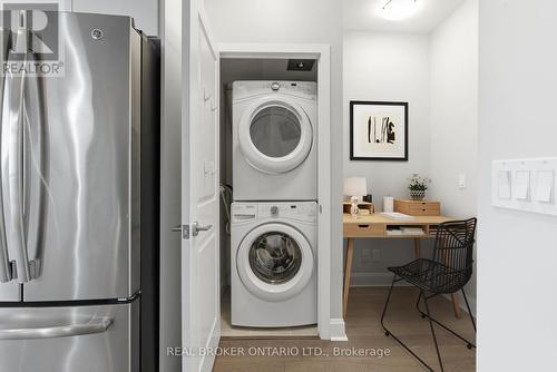 In-suite Laundry & Office Alcove -Virtually Staged - 1801 - 33 Shore Breeze Drive, Toronto, ON - Indoor Photo Showing Laundry Room