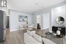 Bright Main Living Area - Virtually Staged - 1801 - 33 Shore Breeze Drive, Toronto, ON  - Indoor 