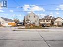 View of front facade with a wooden deck and driveway - 420 Waverly Street, Hamilton, ON  - Outdoor 