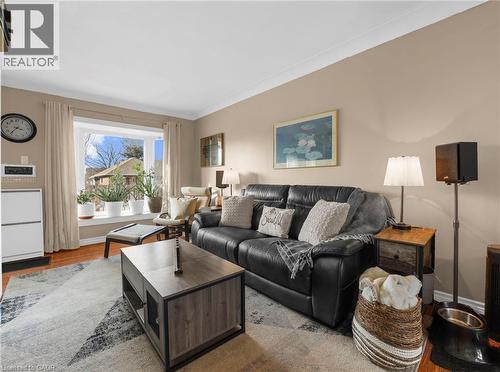 Living area with wood finished floors and ornamental molding - 420 Waverly Street, Hamilton, ON - Indoor Photo Showing Living Room