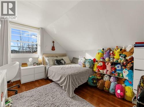 Bedroom featuring dark wood-type flooring and vaulted ceiling - 420 Waverly Street, Hamilton, ON - Indoor Photo Showing Bedroom