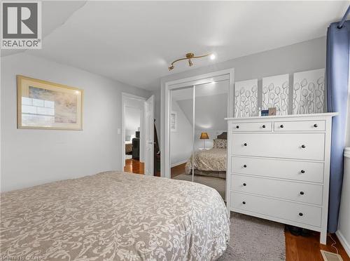 Bedroom featuring a closet and dark wood-type flooring - 420 Waverly Street, Hamilton, ON - Indoor Photo Showing Bedroom