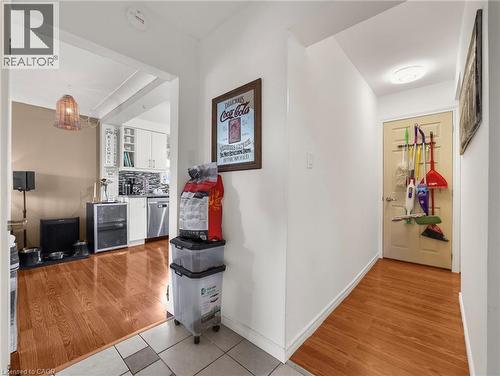 Hallway with light wood-style flooring and beverage cooler - 420 Waverly Street, Hamilton, ON - Indoor Photo Showing Other Room