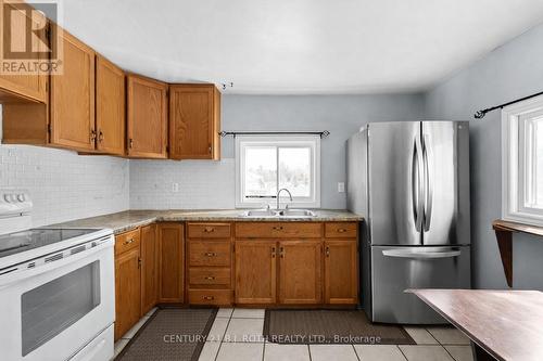 1006 Flos 4 Road E, Springwater, ON - Indoor Photo Showing Kitchen With Double Sink