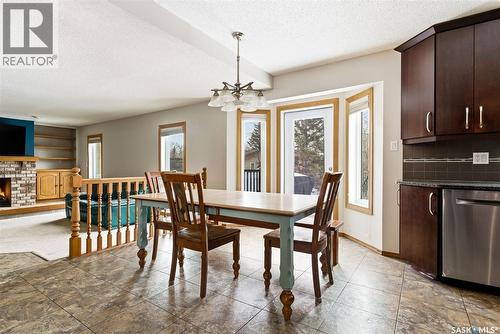 3242 Barton Place E, Regina, SK - Indoor Photo Showing Dining Room With Fireplace