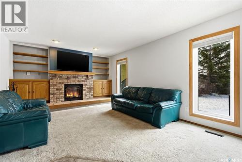 3242 Barton Place E, Regina, SK - Indoor Photo Showing Living Room With Fireplace