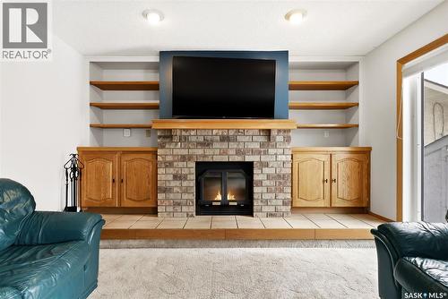 3242 Barton Place E, Regina, SK - Indoor Photo Showing Living Room With Fireplace