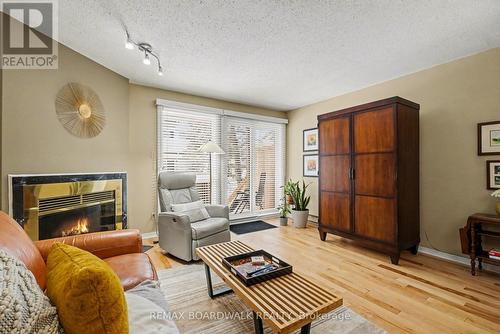 5 Briston Private, Ottawa, ON - Indoor Photo Showing Living Room With Fireplace
