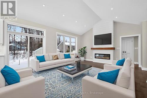 Digitally Staged - 62 Rue Vanier, Tiny, ON - Indoor Photo Showing Living Room With Fireplace