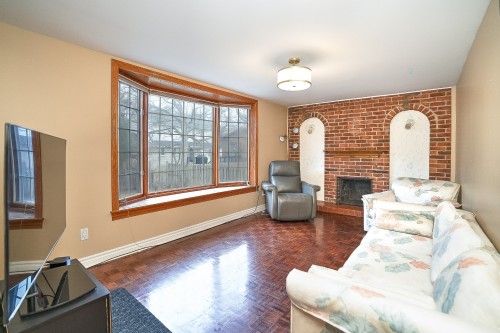 Salle familiale - 12 Rue Lesage, Dollard-Des-Ormeaux, QC - Indoor Photo Showing Living Room With Fireplace