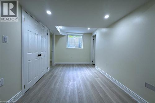 Unfurnished bedroom featuring light wood-type flooring, a closet, and recessed lighting - 59 Windrush Trail S Unit# B, Kitchener, ON - Indoor Photo Showing Other Room