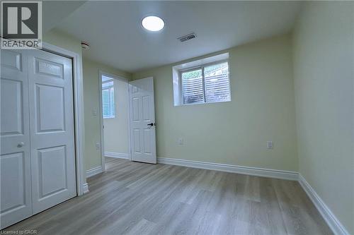 Unfurnished bedroom featuring light wood-style floors and a closet - 59 Windrush Trail S Unit# B, Kitchener, ON - Indoor Photo Showing Other Room