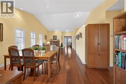 Dining room with dark wood-style floors and lofted ceiling - 48 Hallmark Trail, Hamilton, ON - Indoor Photo Showing Dining Room