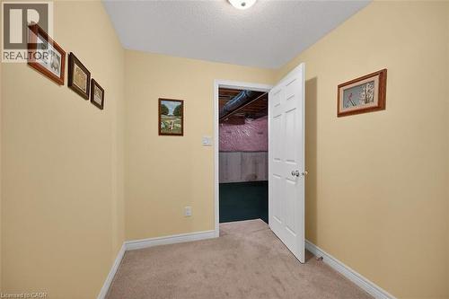 Corridor featuring light carpet and a textured ceiling - 48 Hallmark Trail, Hamilton, ON - Indoor Photo Showing Other Room