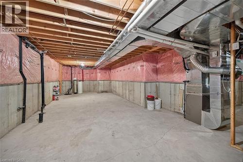 Unfinished below grade area featuring heating unit and a water softener - 48 Hallmark Trail, Hamilton, ON - Indoor Photo Showing Basement