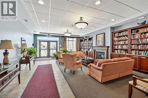 Building lobby featuring a drop ceiling and recessed lighting - 48 Hallmark Trail, Hamilton, ON - Indoor Photo Showing Other Room With Fireplace