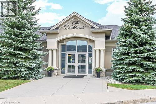 Doorway to property featuring french doors, stone siding, stucco siding, and a shingled roof - 48 Hallmark Trail, Hamilton, ON - Outdoor With Facade