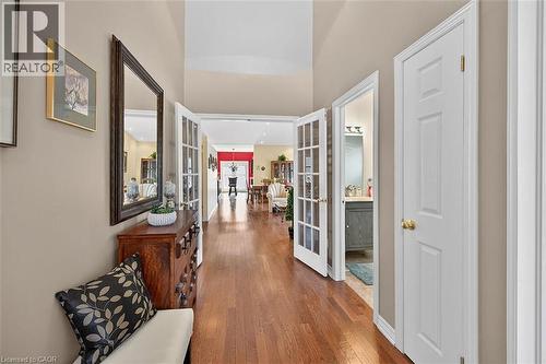 Corridor featuring wood finished floors and french doors - 48 Hallmark Trail, Hamilton, ON - Indoor Photo Showing Other Room