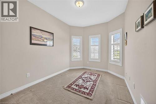 Unfurnished room with light carpet - 48 Hallmark Trail, Hamilton, ON - Indoor Photo Showing Other Room