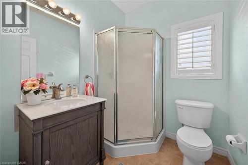 Bathroom featuring vanity, a stall shower, and light tile patterned floors - 48 Hallmark Trail, Hamilton, ON - Indoor Photo Showing Bathroom