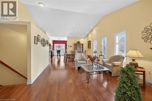 Living room with hardwood / wood-style floors, vaulted ceiling, and recessed lighting - 48 Hallmark Trail, Hamilton, ON - Indoor Photo Showing Living Room
