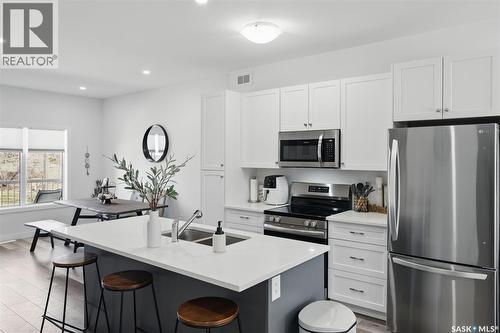 421 L Avenue S, Saskatoon, SK - Indoor Photo Showing Kitchen With Stainless Steel Kitchen With Double Sink With Upgraded Kitchen