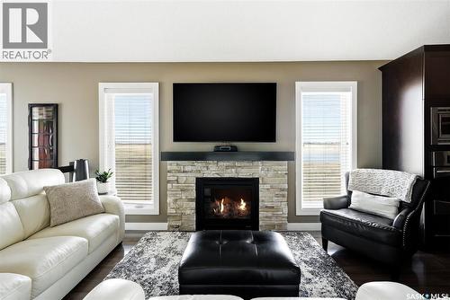 4127 Cumberland Road E, Regina, SK - Indoor Photo Showing Living Room With Fireplace