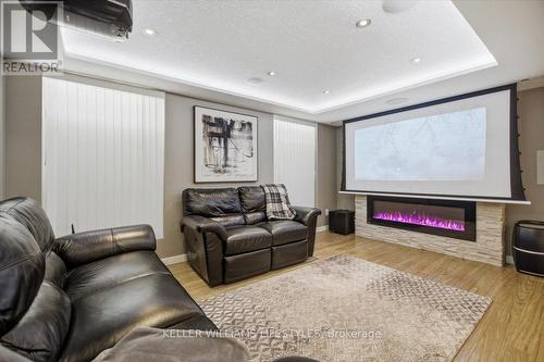 hidden projector screen - 779 North Leaksdale Circle, London South (South U), ON - Indoor Photo Showing Living Room With Fireplace