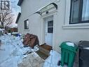 Snow covered property entrance with stucco siding - 206A Springfield Crescent Unit# Lower, Waterloo, ON  - Outdoor With Exterior 