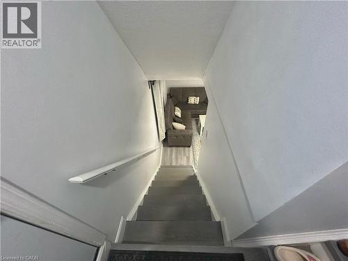 Stairs featuring a textured ceiling - 206A Springfield Crescent Unit# Lower, Waterloo, ON - Indoor Photo Showing Other Room