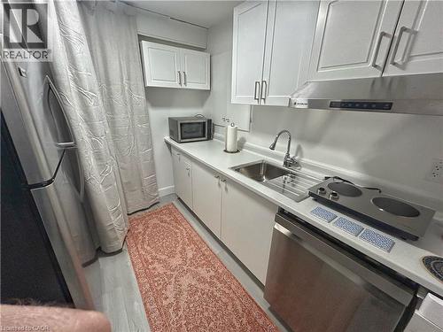 Kitchen with stainless steel appliances, white cabinetry, and light countertops - 206A Springfield Crescent Unit# Lower, Waterloo, ON - Indoor Photo Showing Kitchen