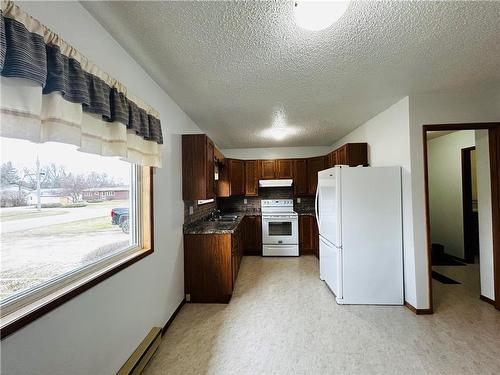 16 Veterans Avenue, Waskada, MB - Indoor Photo Showing Kitchen With Double Sink