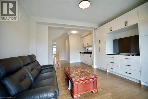 Living room with light wood-style floors and baseboards - 559 Balsam Poplar Street, Waterloo, ON - Indoor Photo Showing Living Room