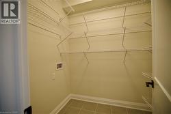 Laundry room featuring hookup for a washing machine and tile patterned flooring - 
