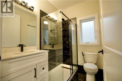Bathroom with vanity and a marble finish shower - 559 Balsam Poplar Street, Waterloo, ON - Indoor Photo Showing Bathroom