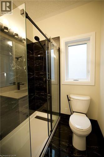 Full bath with toilet and a shower stall - 559 Balsam Poplar Street, Waterloo, ON - Indoor Photo Showing Bathroom