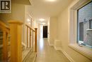 Hall featuring a textured ceiling and light tile patterned floors - 559 Balsam Poplar Street, Waterloo, ON  - Indoor Photo Showing Other Room 