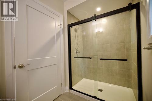 Full bathroom featuring a stall shower and light tile patterned floors - 559 Balsam Poplar Street, Waterloo, ON - Indoor Photo Showing Bathroom