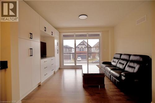 Living room featuring light wood finished floors - 559 Balsam Poplar Street, Waterloo, ON - Indoor Photo Showing Other Room