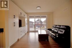Living room featuring light wood finished floors - 