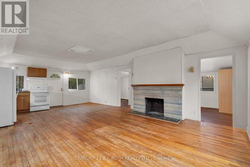 2026 Tiny Beaches Road S, Tiny, ON - Indoor Photo Showing Living Room With Fireplace