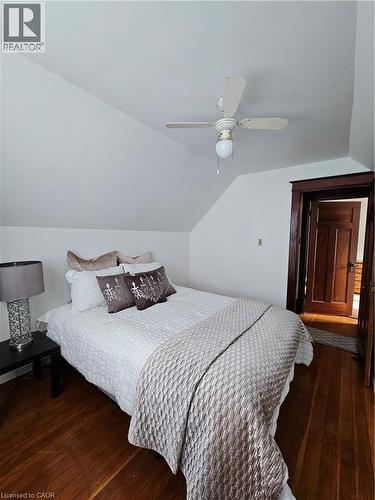 Bedroom featuring dark wood finished floors, a ceiling fan, and lofted ceiling - 253 Grosvenor Avenue S, Hamilton, ON - Indoor Photo Showing Bedroom