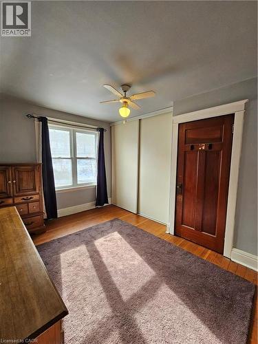 Unfurnished bedroom with a closet, a ceiling fan, and light wood finished floors - 253 Grosvenor Avenue S, Hamilton, ON - Indoor Photo Showing Other Room