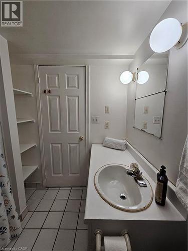 Bathroom featuring vanity and light tile patterned floors - 253 Grosvenor Avenue S, Hamilton, ON - Indoor Photo Showing Bathroom