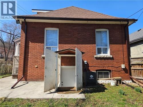 Rear view of house featuring brick siding - 253 Grosvenor Avenue S, Hamilton, ON - Outdoor With Exterior