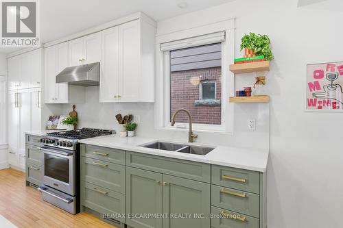 Calacatta-style quartz counters and backsplash - 73 Arkell Street, Hamilton, ON - Indoor Photo Showing Kitchen With Double Sink With Upgraded Kitchen
